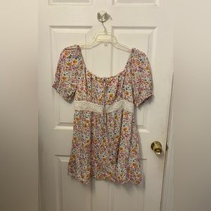 Pink orange flowered white peasant dress with lace waistline.